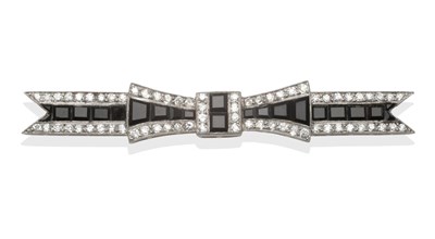 Lot 277 - An Art Deco Onyx and Diamond Bow Brooch, the calibré cut onyx centre two borders of old...