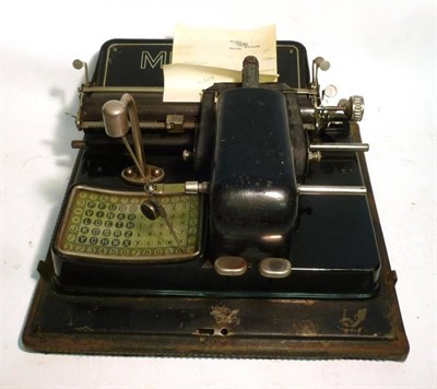 Lot 1033 - A Mignon Typewriter, with black enamelled body, perspex covered keyboard, with tinplate lid