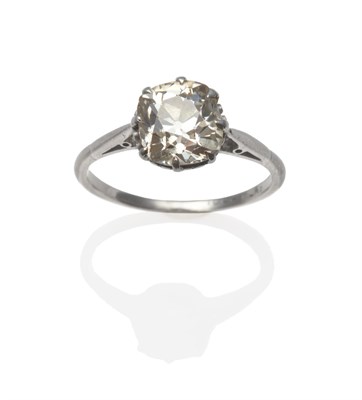 Lot 279 - A Diamond Solitaire Ring, the old mine cut diamond in white pointed claws, on a tapered...