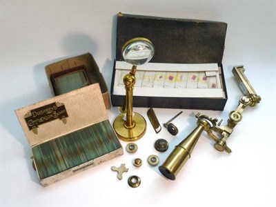 Lot 1047 - A 19th Century Lacquered Brass Gould Type Microscope by Dolland, London, with tapered lower...