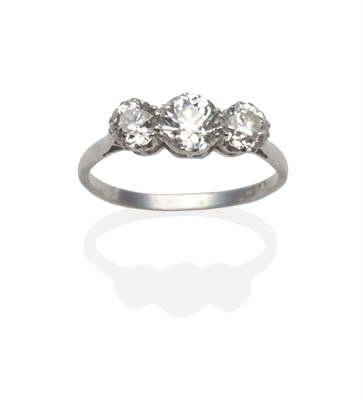 Lot 280 - A Diamond Three Stone Ring, the old cut diamonds in white claw settings, on a tapered shoulder...