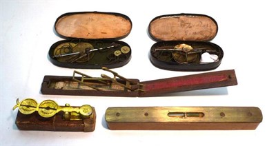 Lot 1069 - Mixed Instruments, comprising two sets of gold scales in toleware cases, a folding guinea scale...