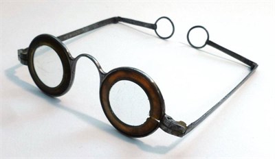 Lot 1080 - A Pair of 18th Century Martins Margins Steel Spectacles, with horn rims, and folding arms