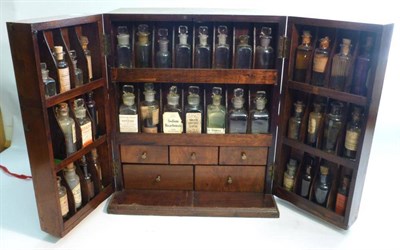 Lot 1084 - A 19th Century Mahogany Apothecary Chest, with hinged front section opening to reveal thirty...