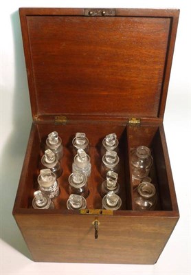 Lot 1085 - A 19th Century Mahogany Apothecary Box, containing fourteen compartmentalised clear glass...