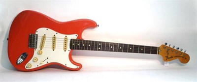 Lot 1128 - A 1974 Fender Stratocaster Electric Guitar, serial number 529856, with coral pink body, maple neck