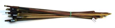 Lot 1177 - Ten Bows, comprising eight cello bows and two violin bows, mainly with ebony frogs and nickel...