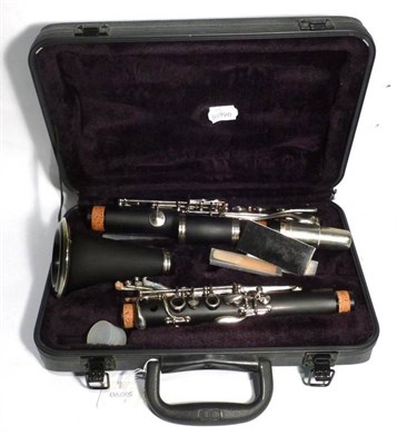 Lot 1201 - A Plastic Clarinet by J Michael, in a hard plastic case; A Selmer Bundy Silver Plated Flute, serial