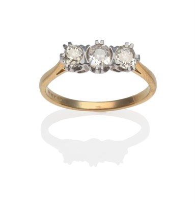 Lot 304 - An 18 Carat Gold Diamond Three Stone Ring, the old cut diamonds in white claw settings on a...