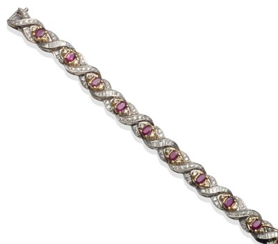 Lot 306 - ~ A Ruby and Diamond Bracelet, oval cut rubies flanked by eight-cut diamonds in yellow claw...