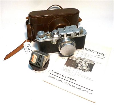 Lot 1231 - A Leica IIIb Camera No.283334, in chrome, circa 1938, with collapsible Summar f2/50mm lens...