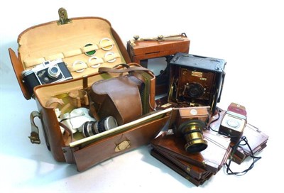 Lot 1236 - Cameras and Accessories, comprising a Sanderson hand and stand camera, folding mahogany plate...