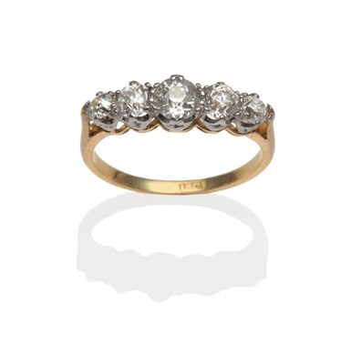 Lot 309 - A Diamond Five Stone Ring, the graduated old cut diamonds in white claw settings, on a yellow...