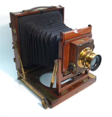 Lot 1264 - A Mahogany and Brass 'Imperial' Folding Field Camera by Thornton-Pickard, 1/2 plate size, with...