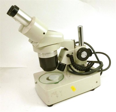 Lot 1038 - A 20th Century Vickers Binocular Microscope, with grey enamel finish, power cable and plug for...