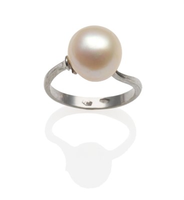 Lot 328 - A Pearl Ring, the off-round pearl over white twist shoulders, on a plain polished shank, finger...