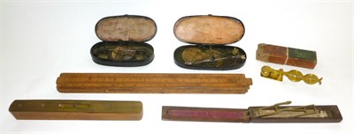 Lot 1059 - Mixed Instruments, comprising two sets of gold scales in toleware cases, a folding guinea scale...