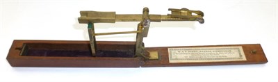 Lot 1061 - A 19th Century Folding Brass Sovereign Scale by W.T.Avery, Birmingham, with makers paper label,...