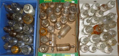 Lot 1068 - A Collection of Sixty Four Clear Glass Chemist's Rounds, most with stoppers, with a mixture of...