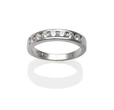 Lot 332 - An 18 Carat White Gold Diamond Half Hoop Ring, the round brilliant cut diamonds channel set, to...