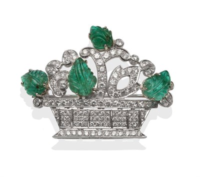 Lot 334 - ~ An Emerald and Diamond Basket Brooch, the emeralds carved as leaves in white claw settings,...