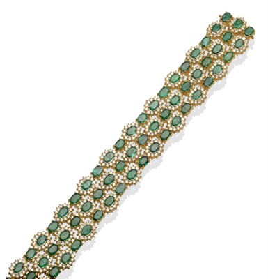 Lot 342 - ~ An Emerald and Diamond Bracelet, three rows of twenty-two alternating oval cut emerald and...