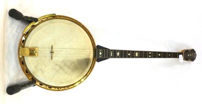 Lot 1168 - A Jedson Four String Banjo, with a rosewood resonator, 11inch velum head, gold plating, mother...