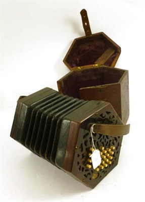 Lot 1175 - A Lachenal Forty Six Key Concertina, with makers paper label, mahogany fretwork ends, bone buttons