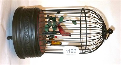 Lot 1190 - A Singing Bird in Cage Musical Automaton, the domed wirework cage enclosing two birds with red...