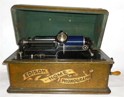 Lot 1193 - An Oak Cased Edison Home Phonograph, serial number H105230, with domed lid, winding handle and...