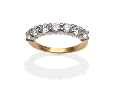 Lot 349 - An 18 Carat Gold Diamond Half Hoop Ring, seven round brilliant cut diamonds in white claw settings