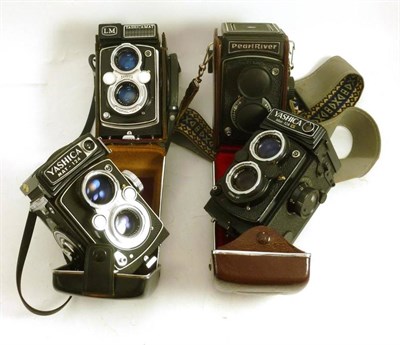 Lot 1226 - Four Twin Lens Reflex Cameras - Yashica Mat 124G, Yashica Mat 124, Yashica Mat LM (cased) and Pearl