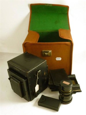 Lot 1234 - A Mahogany and Brass Folding Field Camera, with tapered brown bellows, three brass barrel...