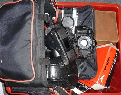 Lot 1244 - Cameras and Accessories, including two chrome Canon AE-1 Program cameras, a black Canon A-1 camera