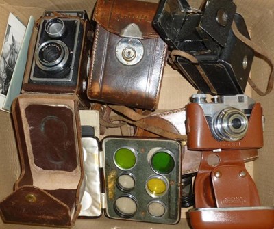 Lot 1246 - Cameras and Accessories, including a Rolleiflex TLR camera No.52492, in a stitched leather case...