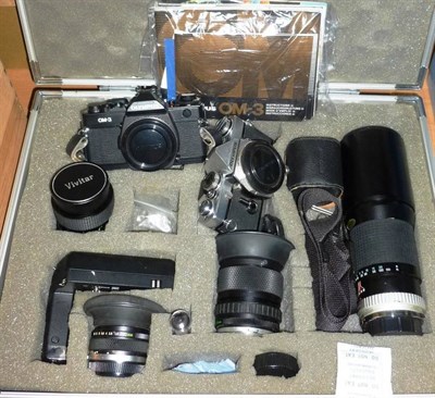 Lot 1257 - Olympus OM Cameras and Accessories, including a black OM-3 body, silver OM-1 body, Zuiko f4/35-70mm