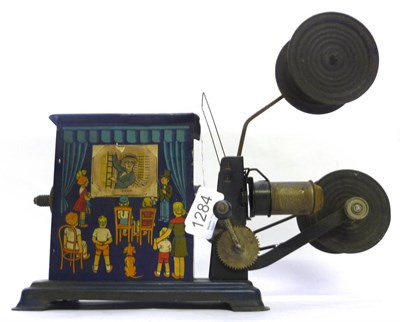 Lot 1284 - A German Tinplate Toy Projector by Ernst Plank, lithographed to all sides with comic scenes of...