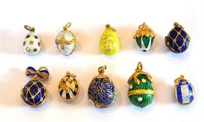 Lot 356 - ~ Nine Egg Charms and An Acorn Charm, enamelled in assorted colours, some set with white paste...