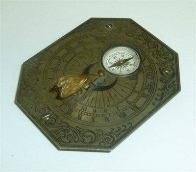 Lot 1011 - A Brass Pocket Sundial, with silvered face, folding gilt metal gnomon and inset compass, 6.5cm...