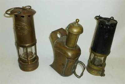 Lot 1028 - Two Brass Miners Safety Lamps - Richard Johnson Clapham Morris Ltd, Manchester, with a tinplate...