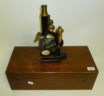 Lot 1038 - A Black Enamelled Monocular Compound Microscope by R Winkel, Gottingen, No.22013, with rack &...