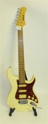 Lot 1066 - A Shine Strat Style Guitar with maple neck, rosewood fingerboard, cream body with tortoiseshell...