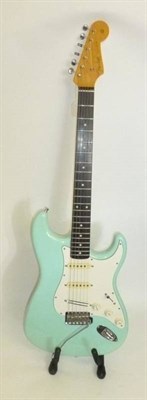 Lot 1106 - Oasis Interest - A Fender Japan Stratocaster, finished in Surf Green with rosewood neck, circa...