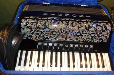 Lot 1141 - An Italian Vignoni 'Ravel IV' Piano Accordion, the black plastic body set with coloured...