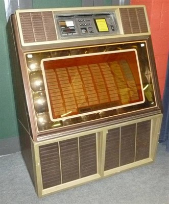 Lot 1149 - A Rowe Ami 200 Selection Stereo Juke Box, the smoked glass fascia decorated with coloured...