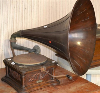 Lot 1164 - An Oak Cased Horn Gramophone by The Gramophone & Typewriter Co., with shell motif decoration,...