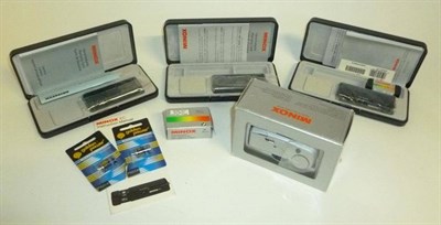 Lot 1177 - Three Boxed Minox EC Subminiature Cameras, unused with cards straps on plastic boxes; A Boxed Minox