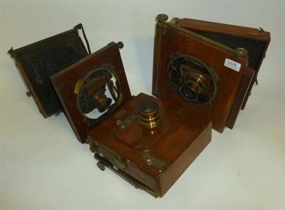 Lot 1179 - Three Mahogany and Brass Field Cameras, no makers names, including a tailboard camera with Thornton