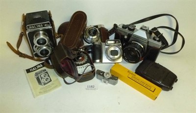 Lot 1182 - Six Cameras, including a Coronet Vogue in brown bakelite, Ensign Midget in suede case, Halina...