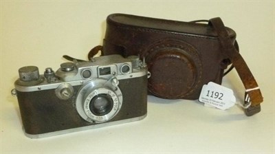 Lot 1192 - A Leica IIIb Camera No.319794, circa 1939, in chrome, with collapsible screw mount Elmar...